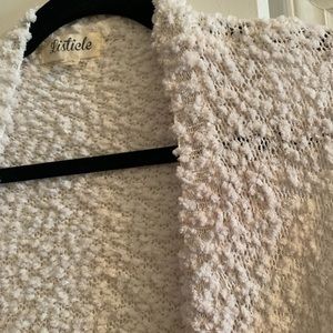 White Cardigan sweater.